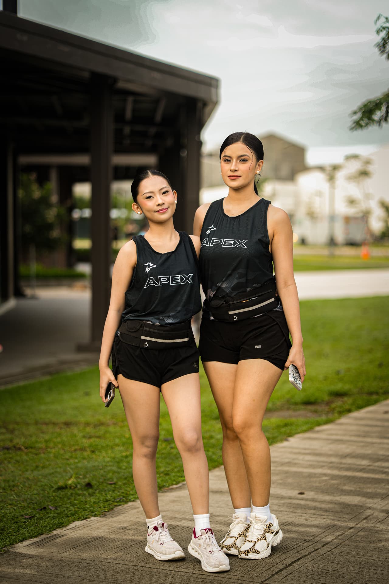 Two Run Club members wearing the Apex singlets on the walkway